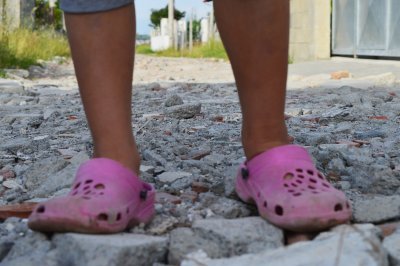 The boy in pink shoes shines at school